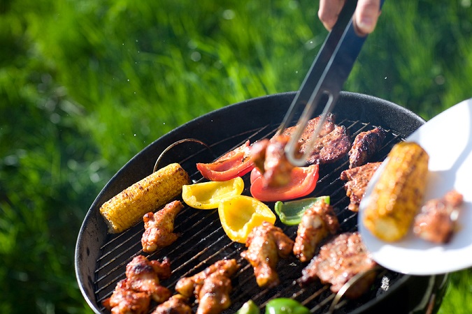 Grilling at summer weekend. Fresh meat and vegetables preparing