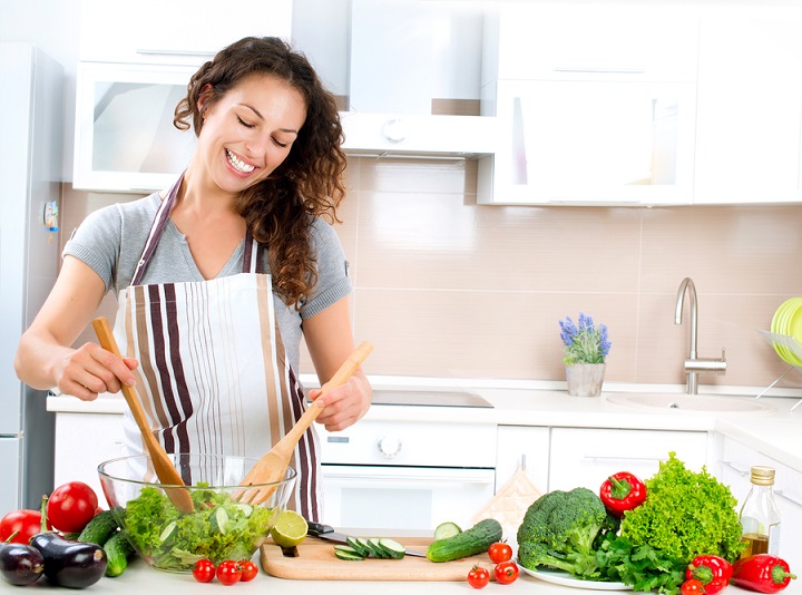 Young Woman Cooking. Healthy Food - Vegetable Salad. Diet. Dieti